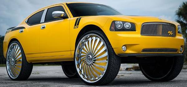 32x10 DUB SWYRL Custom Yellow Spinning Wheels on Dodge Charger