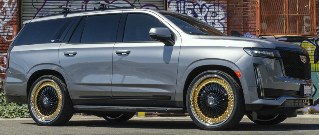 26x10 DUB Lynk S835 Gloss Black with Gold Ring on 2023 Cadillac Escalade